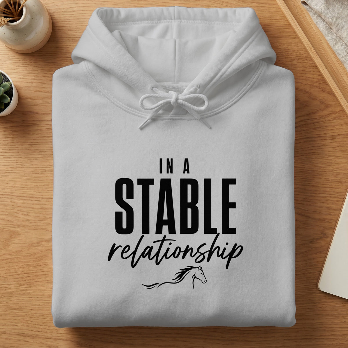 White hoodie with "In A Stable Relationship" text and horse graphic.