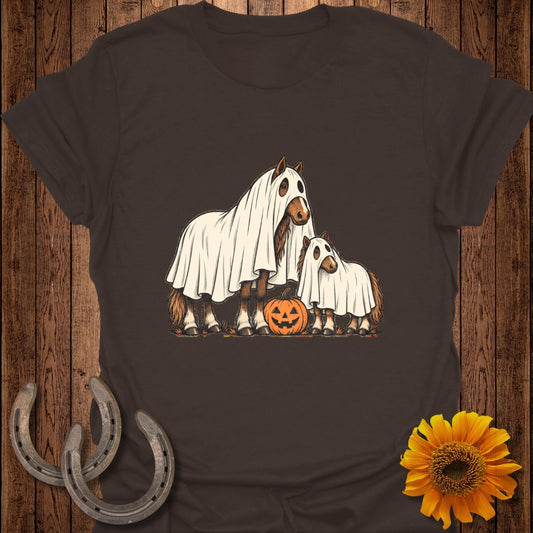Two horses in ghost costumes with a pumpkin on a brown shirt.