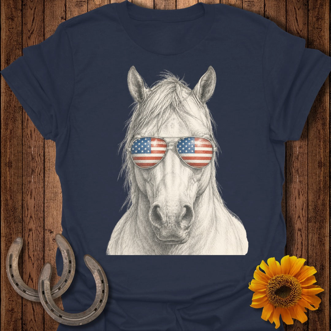 Horse wearing sunglasses with American flag lenses on navy shirt.