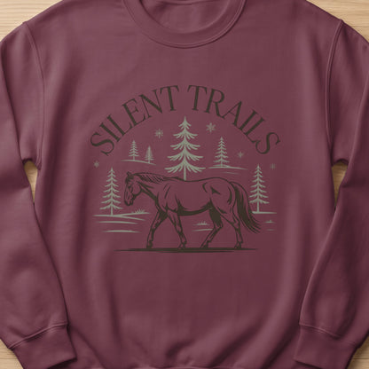 Maroon sweatshirt with "Silent Trails" text above a walking horse and trees.