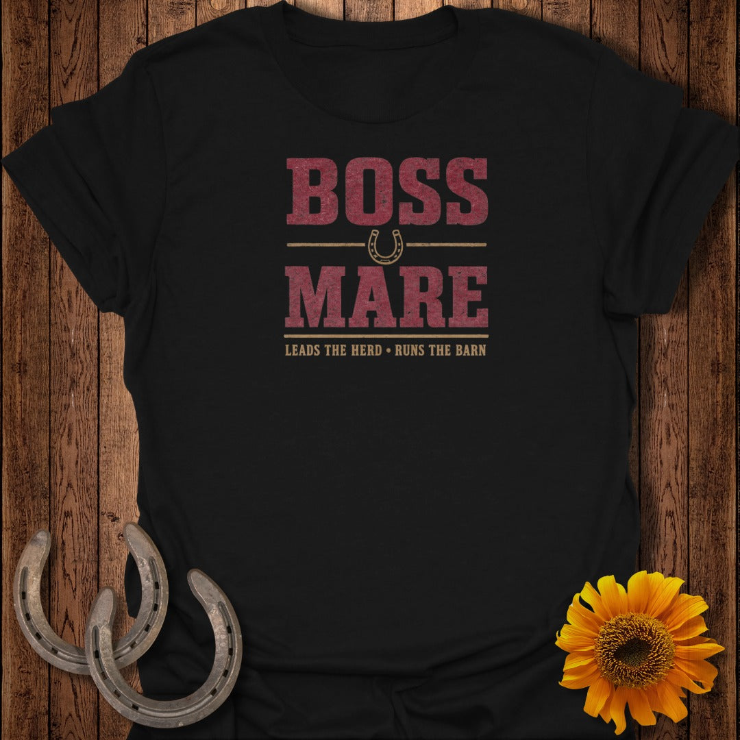 Black t-shirt with "BOSS MARE" and horseshoes graphic, and text "LEADS THE HERD. RUNS THE BARN."