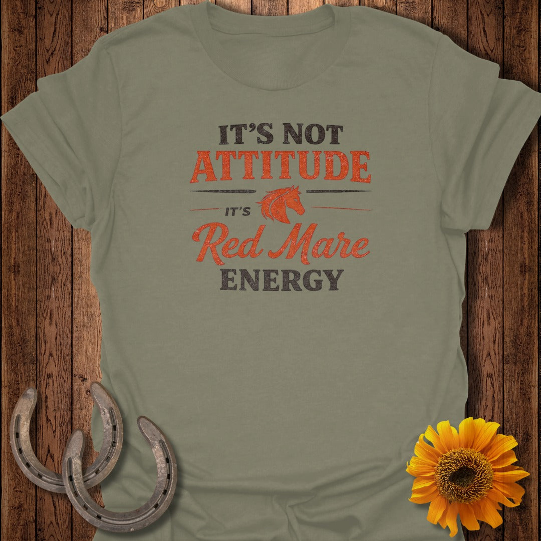 Green t-shirt with "It's Not Attitude, It's Red Mare Energy" text.
