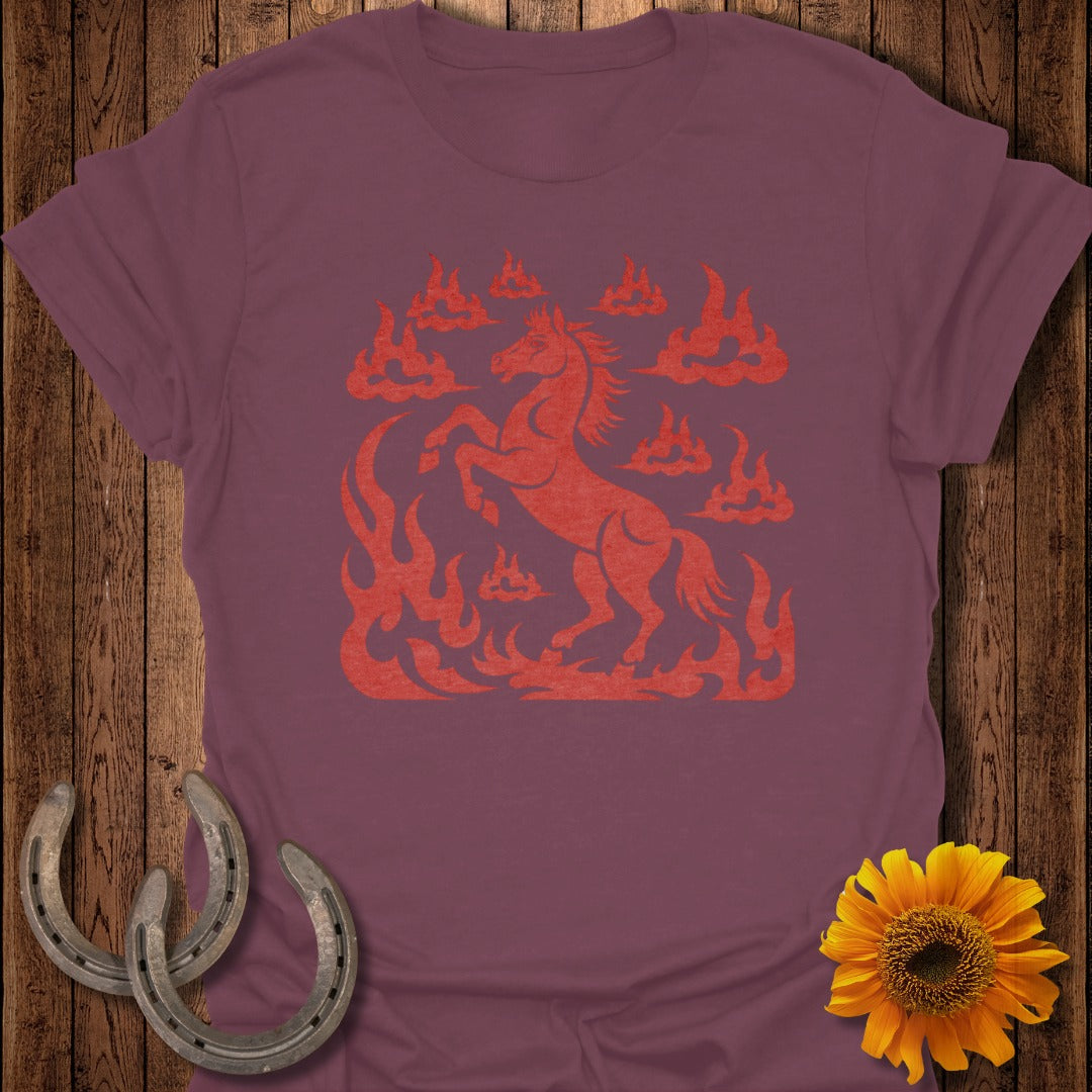 Red horse silhouette with flames and clouds on burgundy t-shirt.