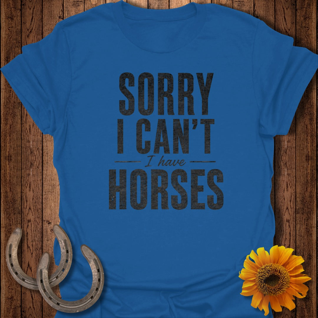 Blue t-shirt with "SORRY I CAN'T HORSES" text, horseshoes, and sunflower.