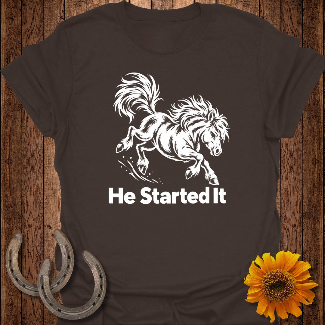 Brown t-shirt with white galloping horse graphic and text "He Started It."