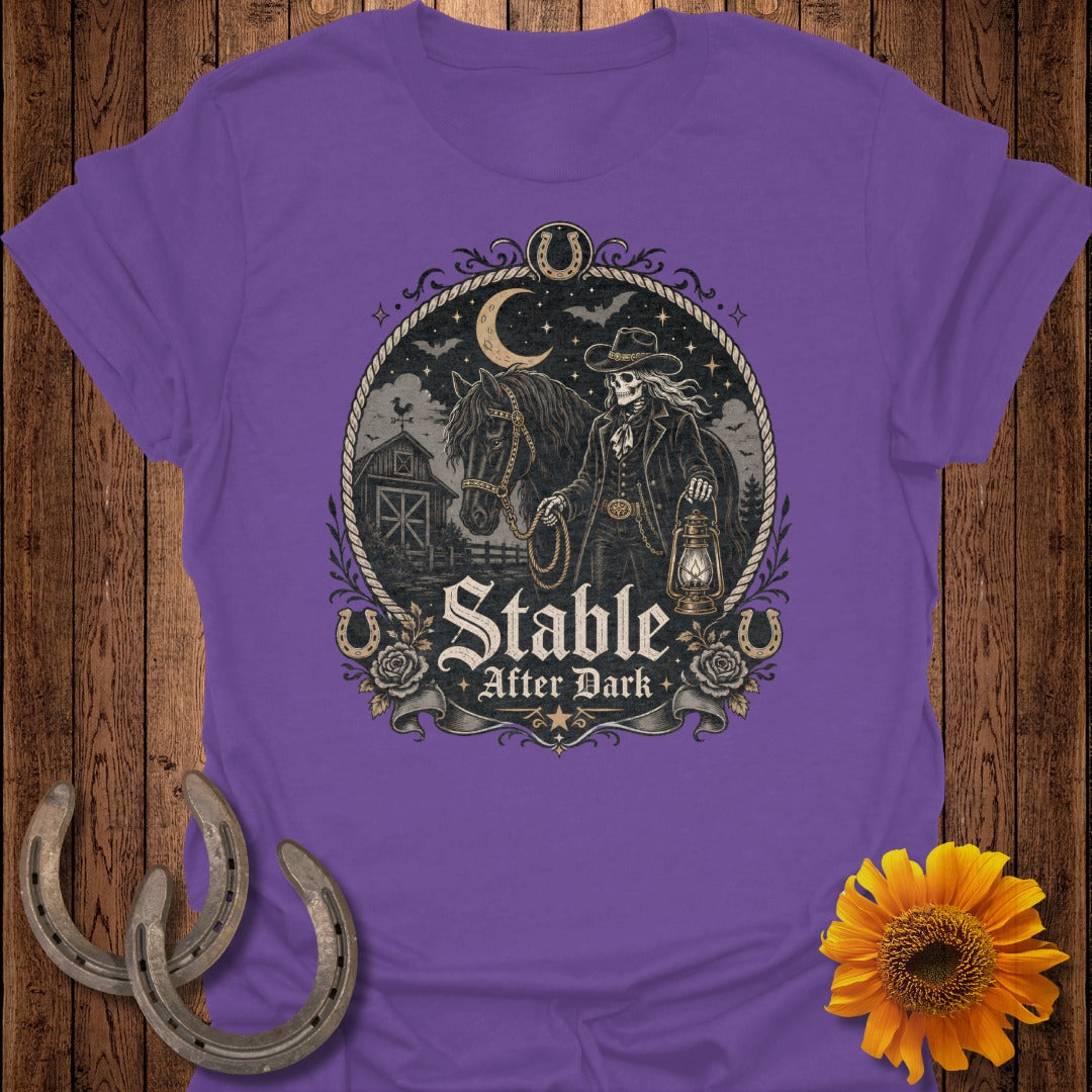 T-shirt graphic: Skeleton cowboy with lantern and horse, reads "Stable After Dark".