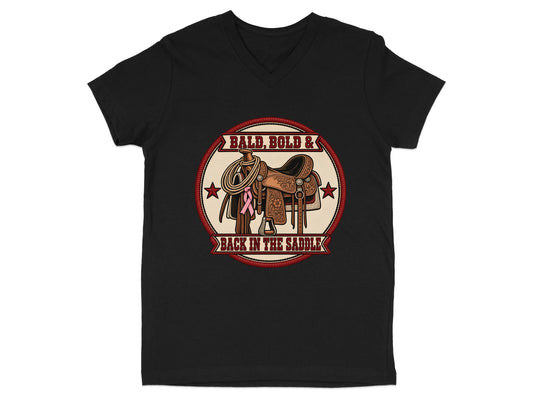 Black V-neck t-shirt with circular graphic of western saddle, rope, pink ribbon, and text "BALD, BOLD & BACK IN THE SADDLE."