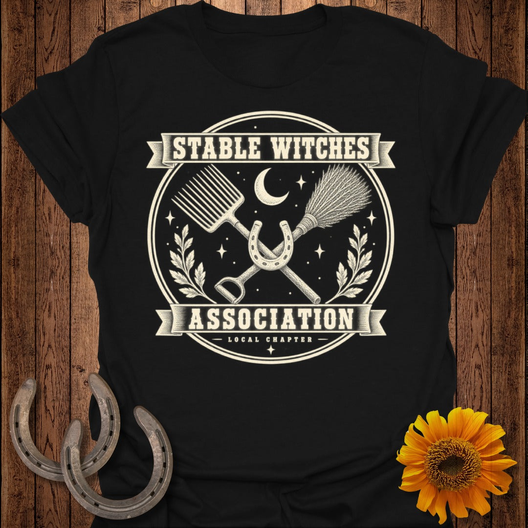 Black t-shirt with "Stable Witches Association Local Chapter" text and witchy symbols.
