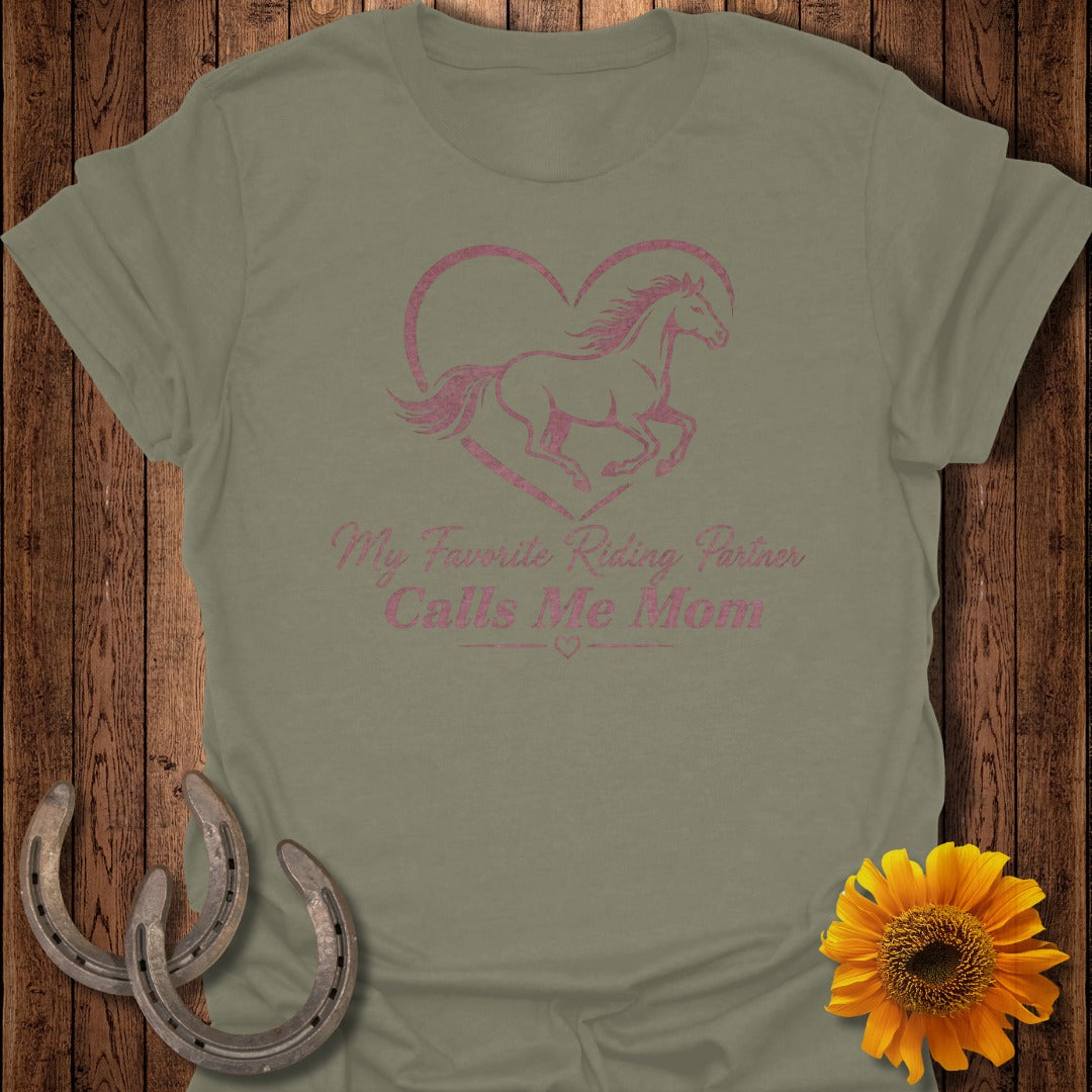 Olive t-shirt with pink glitter horse in heart and "My Favorite Riding Partner Calls Me Mom" text.