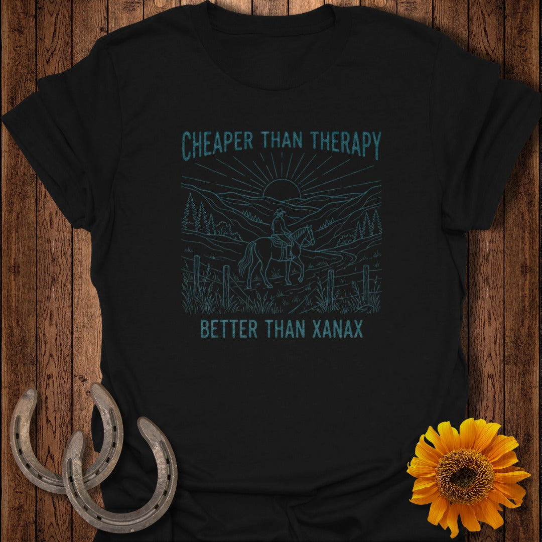 Black t-shirt with blue line art: "Cheaper Than Therapy, Better Than Xanax" with rider on horseback.