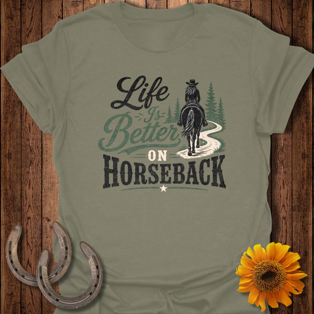 Olive green t-shirt with "Life is Better on Horseback" graphic and horseshoes and sunflower.
