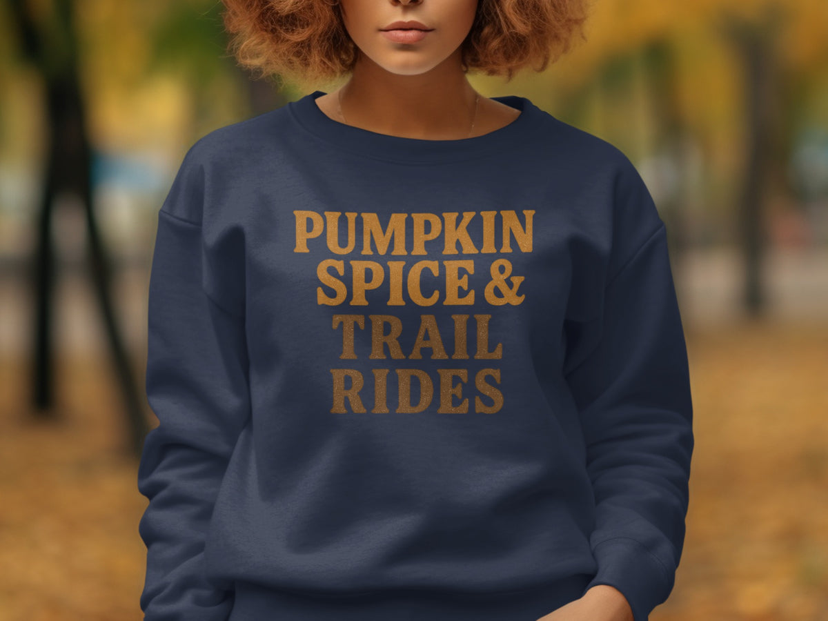 Navy sweatshirt with "PUMPKIN SPICE & TRAIL RIDES" text in orange.