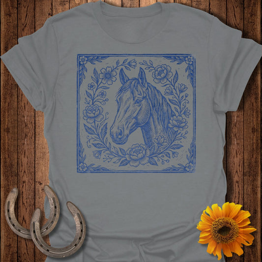 Blue horse head illustration surrounded by flowers within a square border.