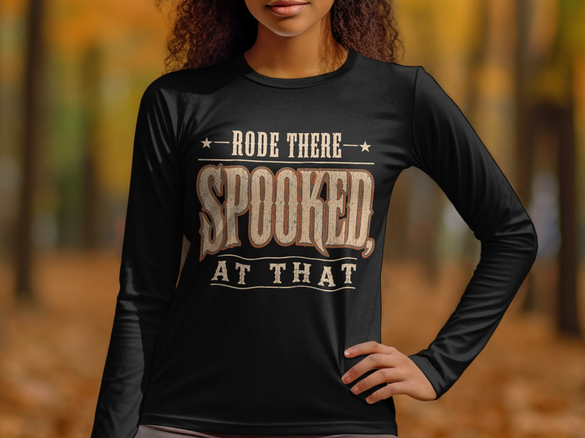 Black long-sleeve shirt with text "RODE THERE SPOOKED AT THAT."