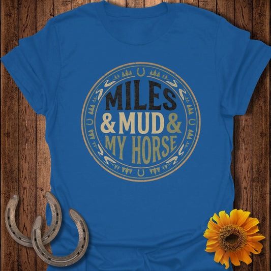 Blue t-shirt with text "MILES & MUD & MY HORSE" in a circular design.