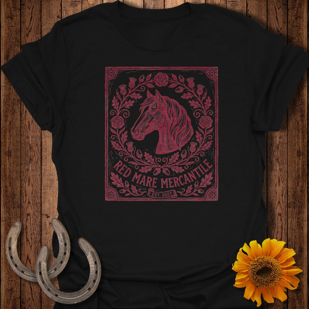 Black t-shirt with a distressed red horse head and floral emblem.