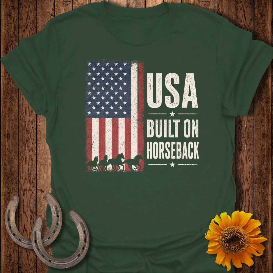 Green t-shirt with American flag graphic and text "USA BUILT ON HORSEBACK".