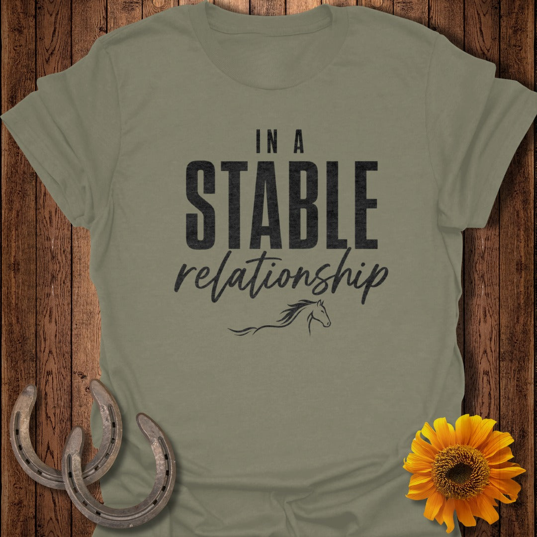 Olive green t-shirt with "IN A STABLE relationship" text and a horse silhouette.