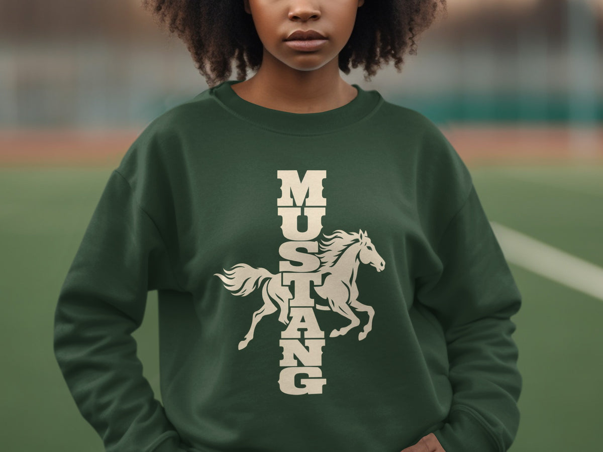 A person wearing a dark green crewneck sweatshirt featuring a graphic of a running horse and the vertical text MUSTANG.