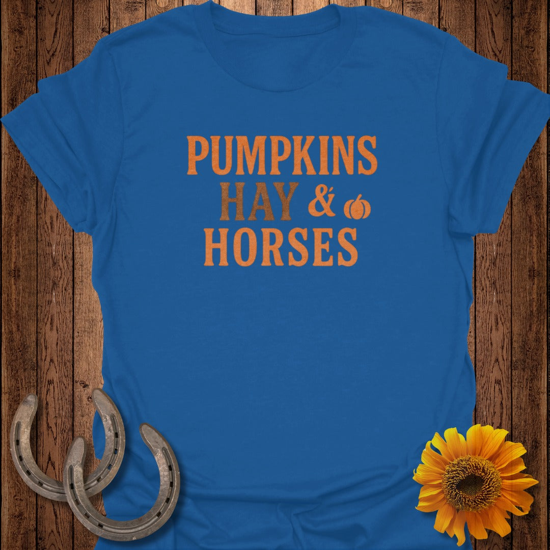 Blue t-shirt with orange text "PUMPKINS HAY & HORSES" and a pumpkin graphic.