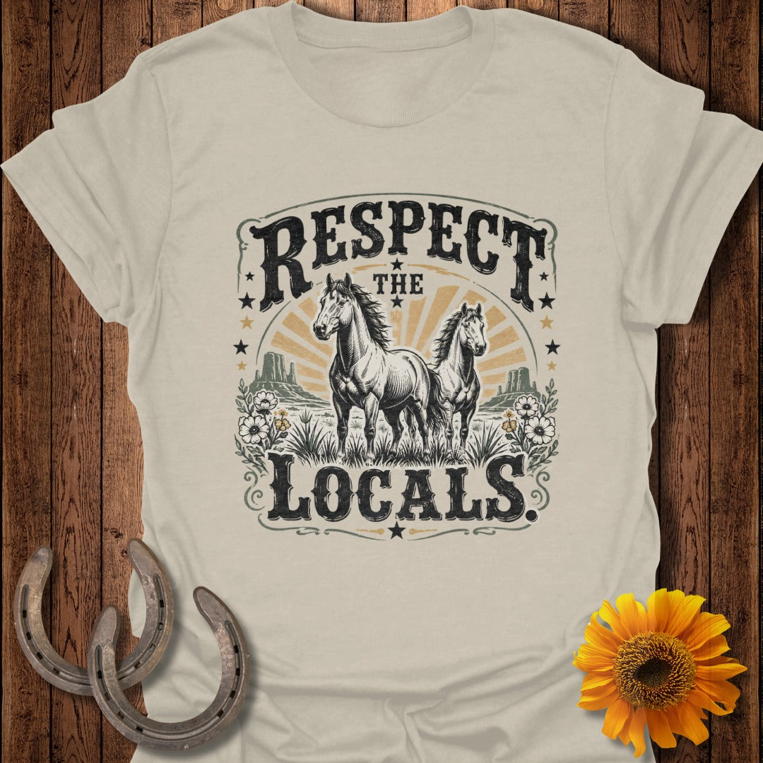 T-shirt graphic with horses, desert landscape, and text "Respect the Locals".