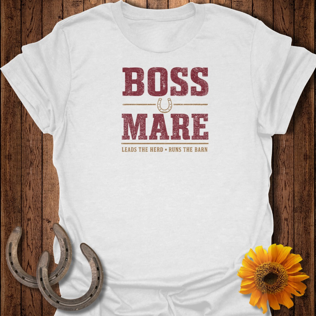 White t-shirt with distressed text and horseshoe: "BOSS MARE LEADS THE HERD•RUNS THE BARN".