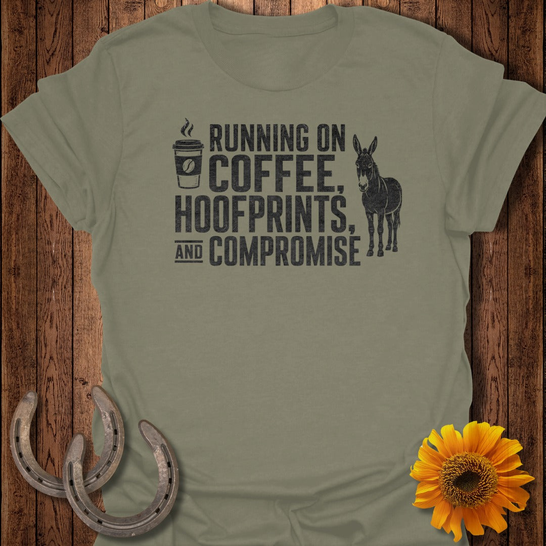 Olive green t-shirt with black text and donkey illustration: "Running on Coffee, Hoofprints, and Compromise."