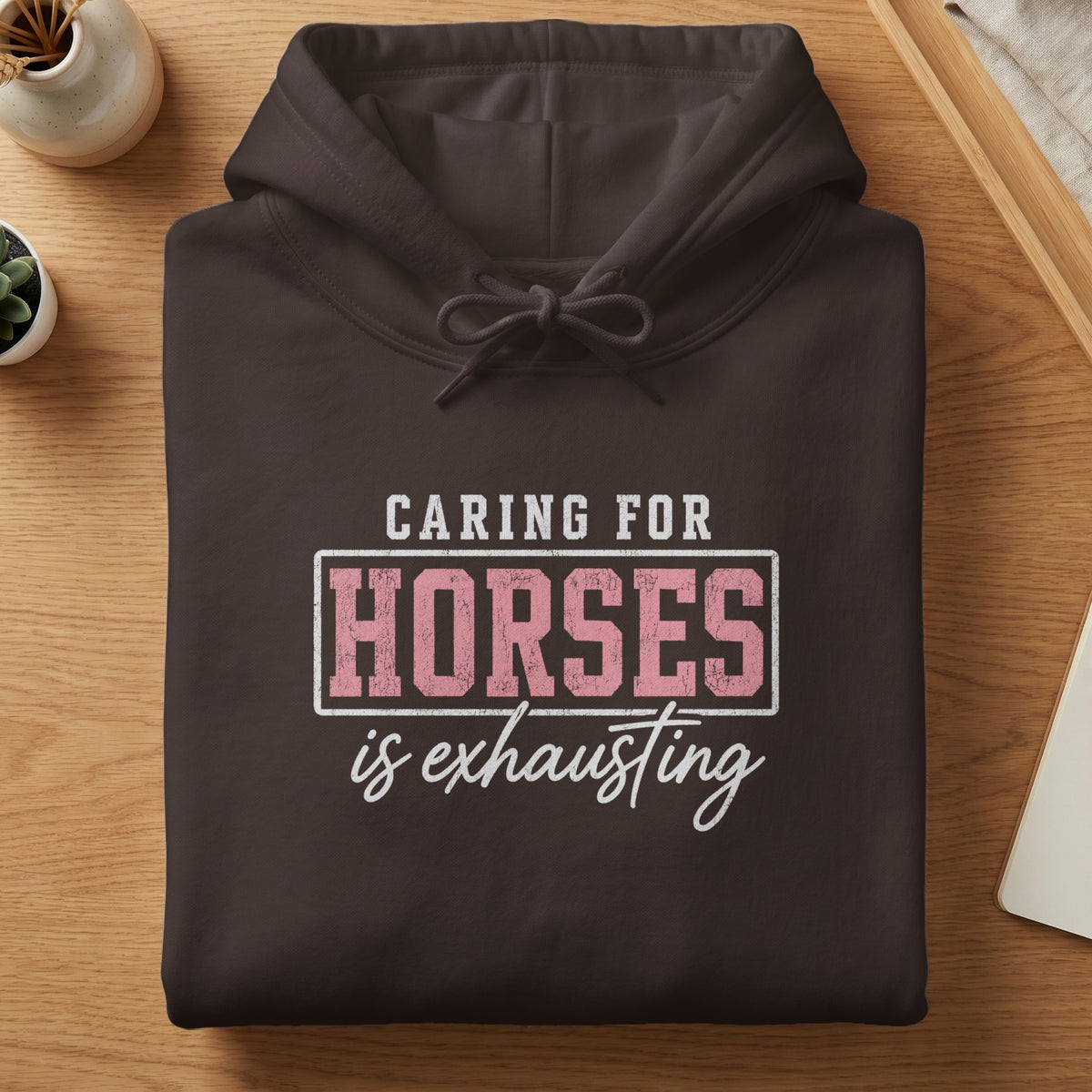 Brown hoodie with text "Caring for Horses is Exhausting"