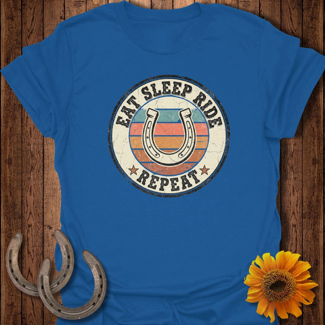 Blue t-shirt with "Eat Sleep Ride Repeat" and horseshoe graphic.