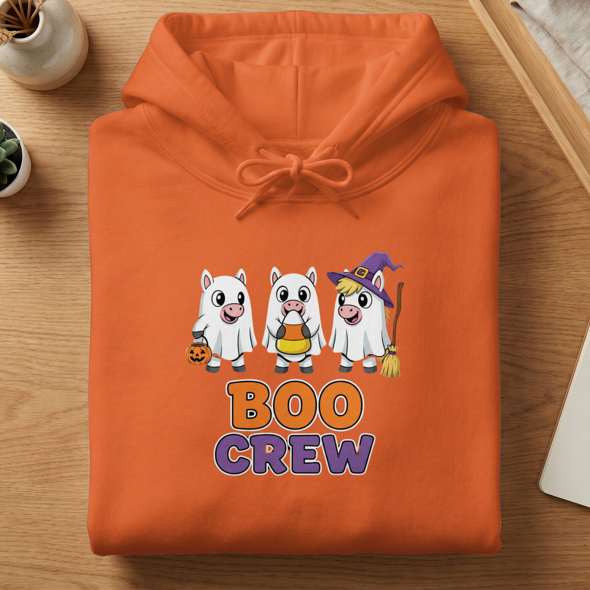Orange hoodie with cartoon ghosts, candy corn, pumpkin, broom, and "BOO CREW" text.