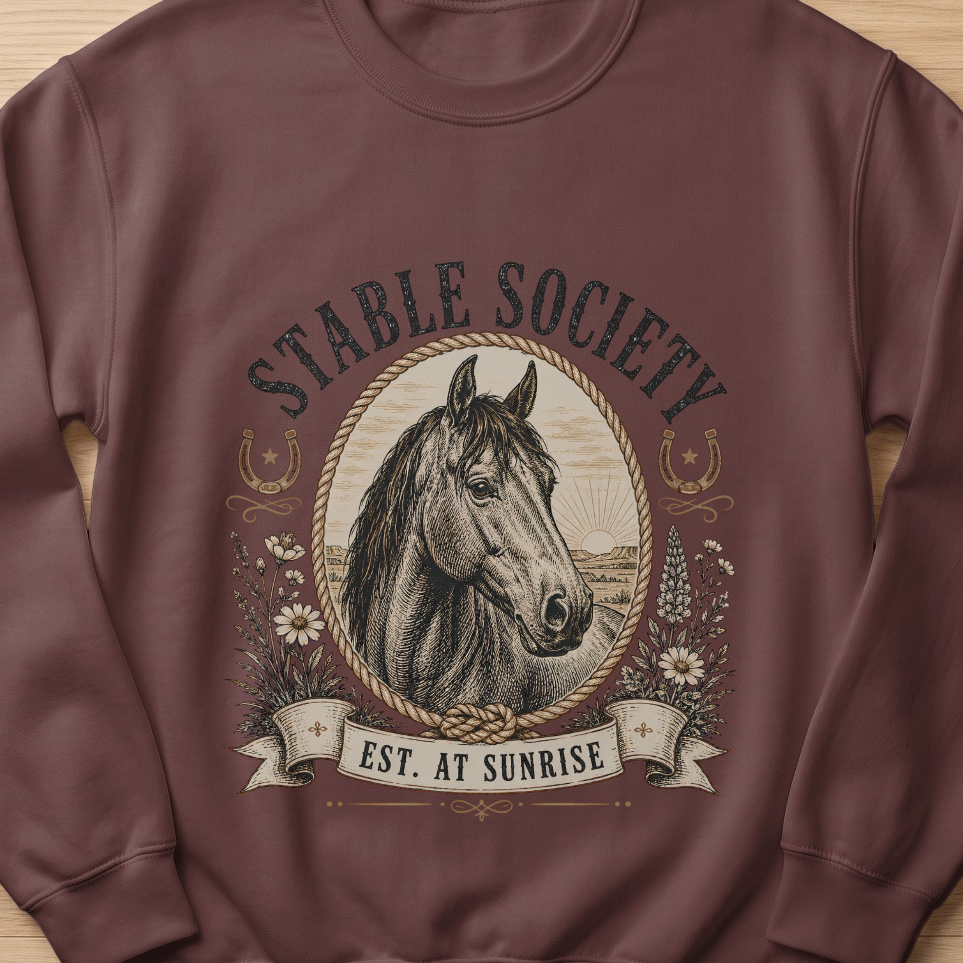 Brown sweatshirt with vintage horse illustration and "Stable Society Est. At Sunrise" text.