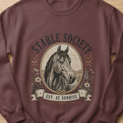Brown sweatshirt with vintage horse illustration and "Stable Society Est. At Sunrise" text.