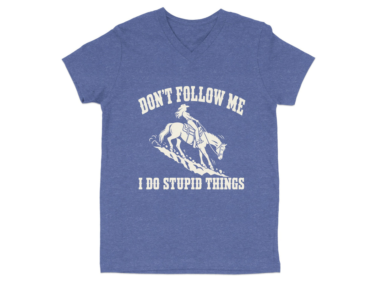 Heather blue V-neck T-shirt featuring a white graphic of a cowboy riding a bucking horse with the text DON'T FOLLOW ME I DO STUPID THINGS.