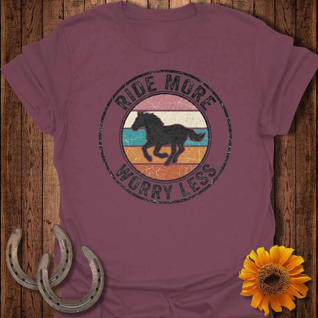 T-shirt with circular graphic featuring a horse silhouette and text "Ride More Worry Less".