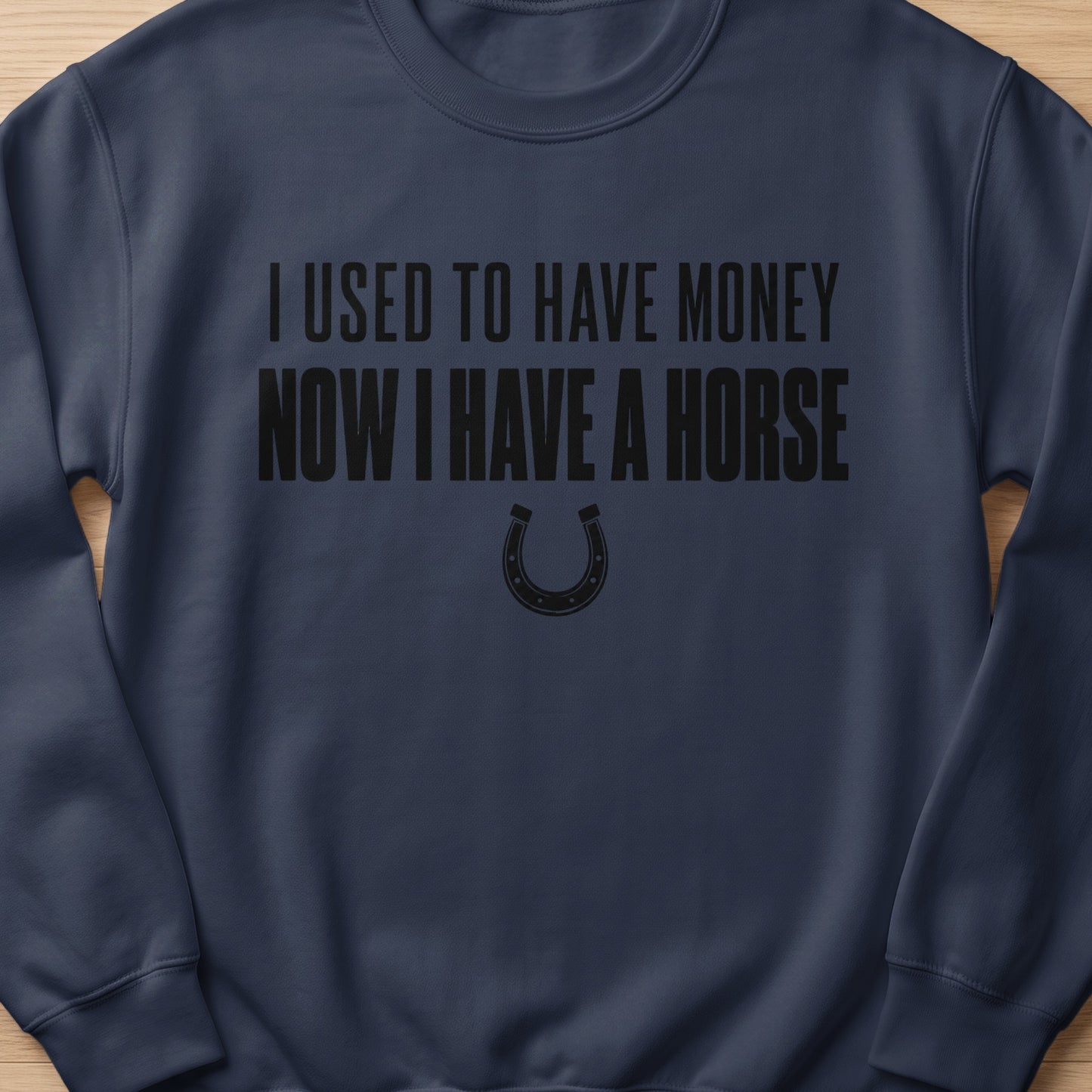 Navy sweatshirt with text "I USED TO HAVE MONEY NOW I HAVE A HORSE" and a horseshoe.