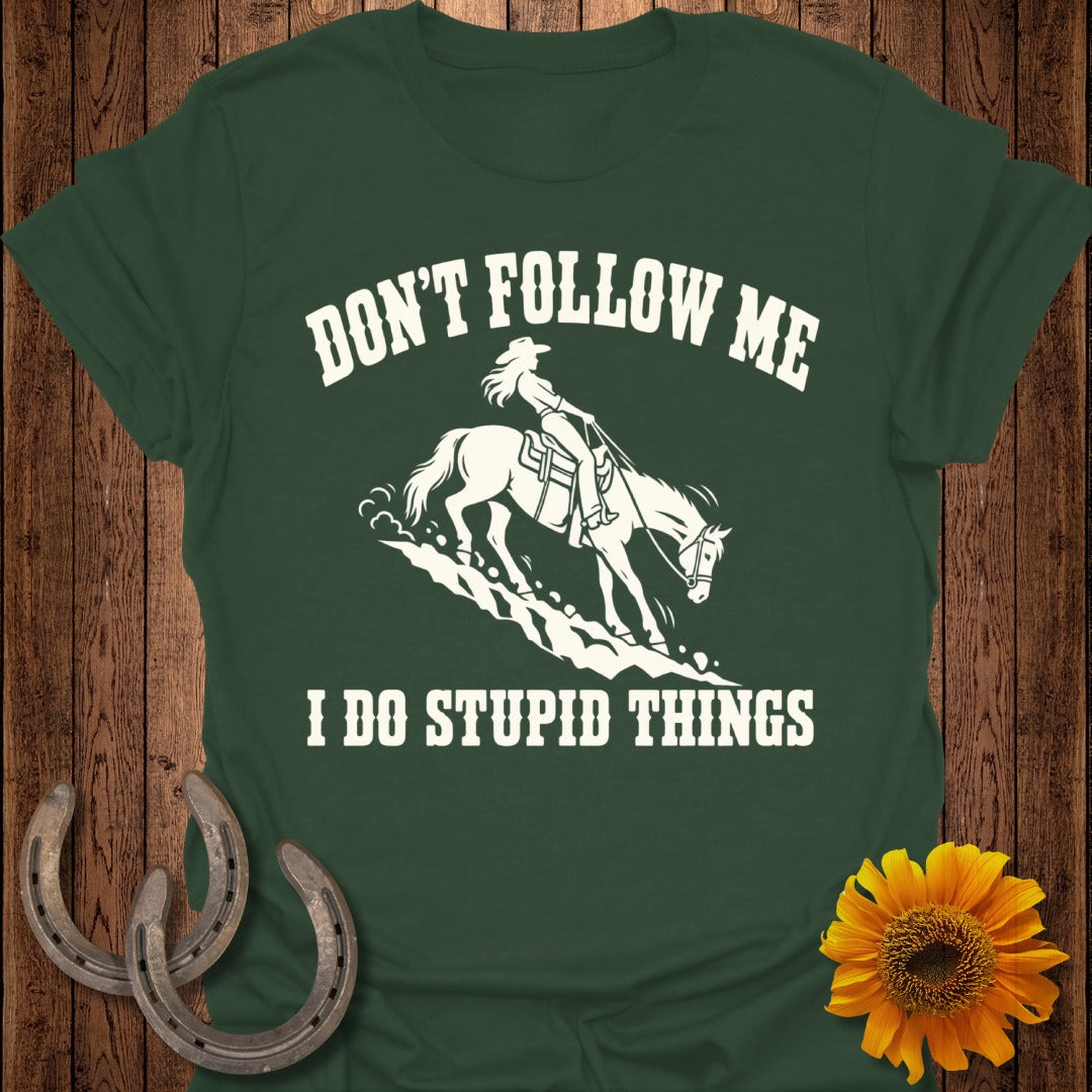 Dark green t-shirt with white text and graphic of a woman on horseback.