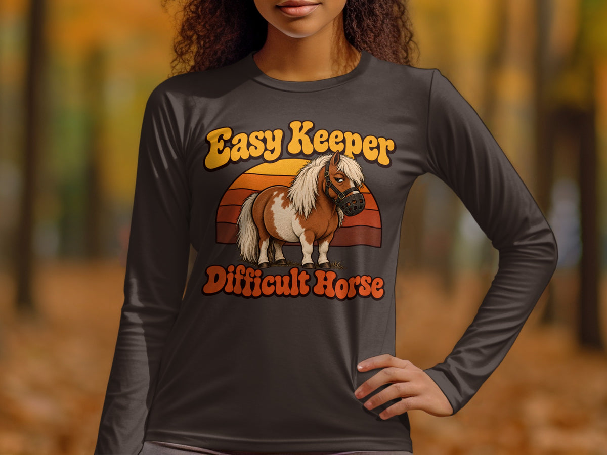 Long sleeve shirt with brown and white pony and text "Easy Keeper Difficult Horse".
