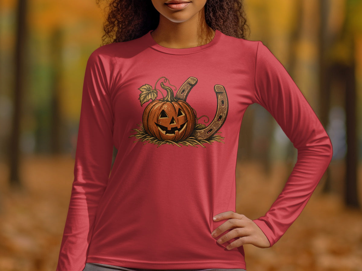 Halloween pumpkin with leaves and a horseshoe on a red long-sleeve shirt.