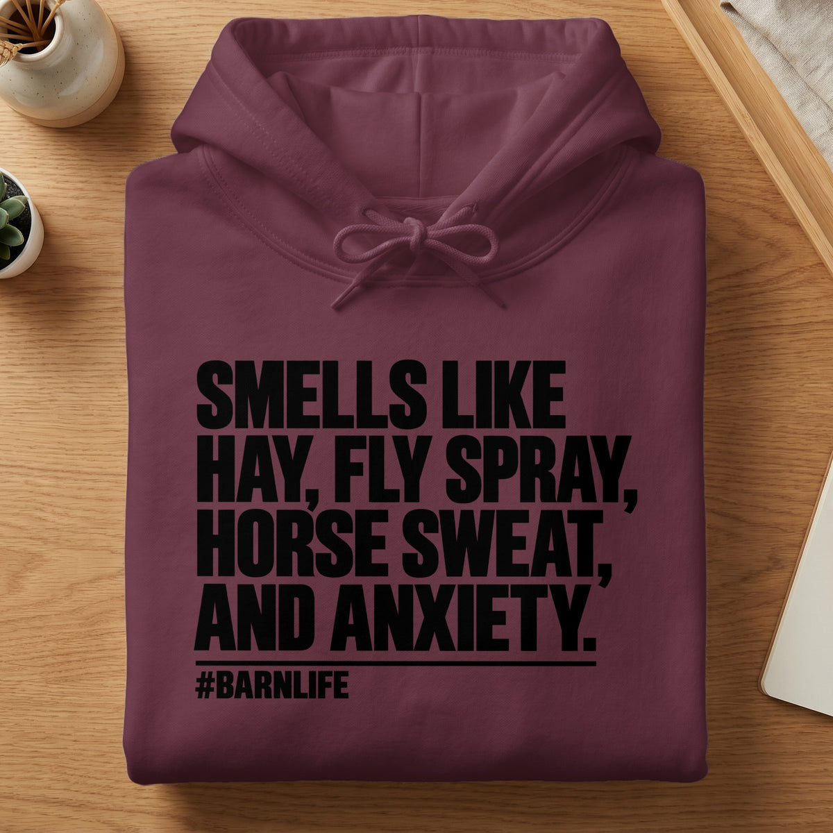 Maroon hoodie with black text "Smells like hay, fly spray, horse sweat, and anxiety. #BARNLIFE"