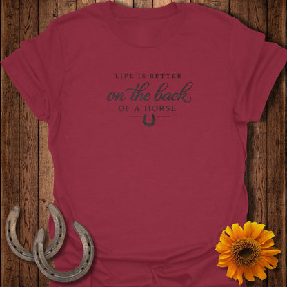 Maroon t-shirt with "Life is better on the back of a horse" text and horseshoe.