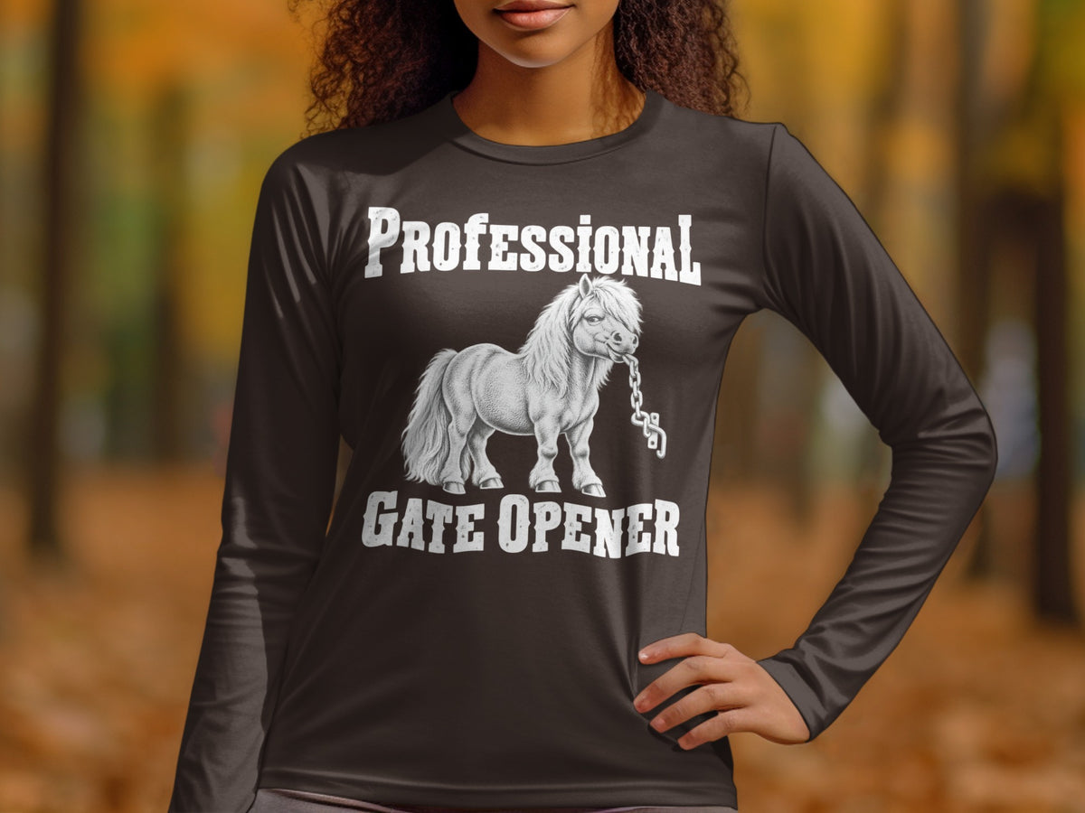 A person wearing a long-sleeve dark shirt with a white graphic of a pony biting a chain.