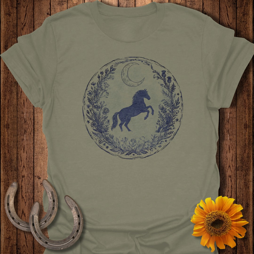 Horse and moon in floral circle on green t-shirt with horseshoes and sunflower.