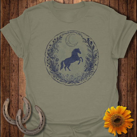 Horse and moon in floral circle on green t-shirt with horseshoes and sunflower.