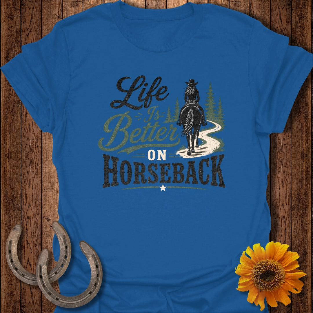 Blue t-shirt with "Life is Better on Horseback" graphic of a rider on a trail.