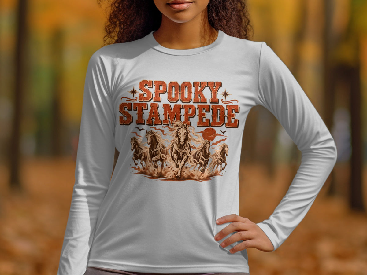 White long-sleeve shirt with "Spooky Stampede" text and galloping horses graphic.