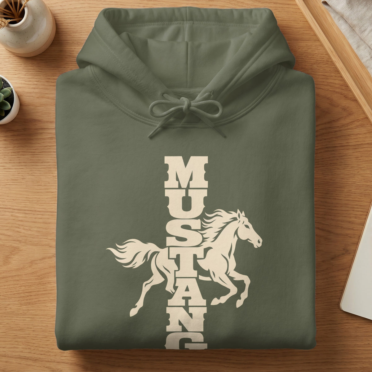 Folded olive green hoodie with a white vertical graphic featuring a running horse and the word Mustang.