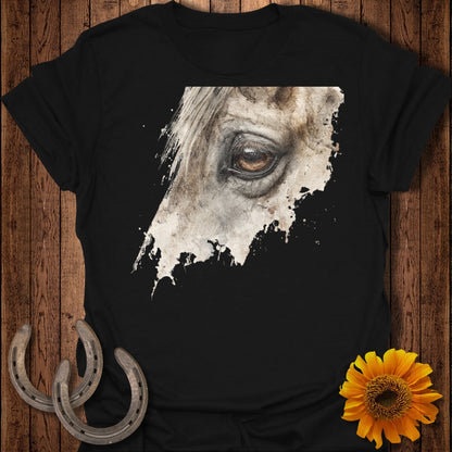 Close-up watercolor art of a horse's eye on a black t-shirt.