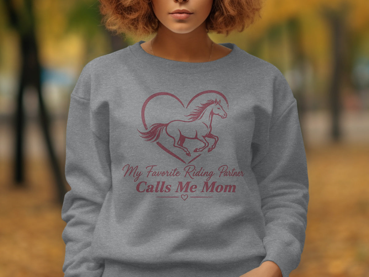 Grey sweatshirt with "My Favorite Riding Partner Calls Me Mom" text and horse graphic.