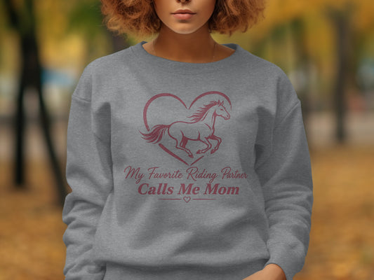 Grey sweatshirt with "My Favorite Riding Partner Calls Me Mom" text and horse graphic.