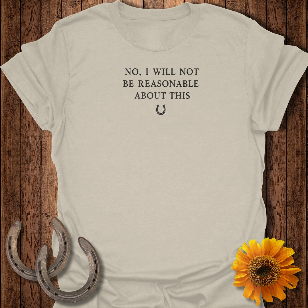 Light tan t-shirt with text "NO, I WILL NOT BE REASONABLE ABOUT THIS" and a horseshoe.